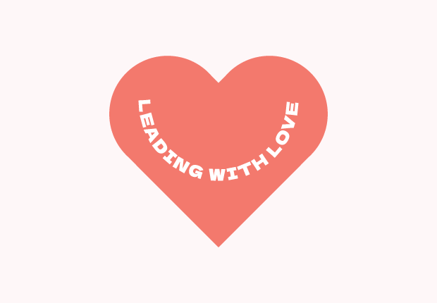 coral red heart with "leading with love" inside the heart.